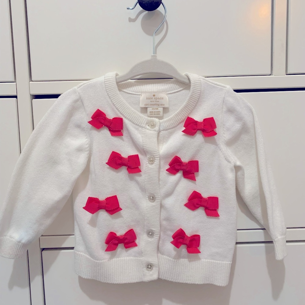 Kate Spade infant cardigan. Size 6 months. Color white with pink bows.